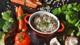 being vegetarian - food served in a bowl with carrots and tomato around it