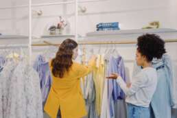 women discussing over clothes shopping