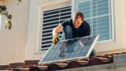 a man installing solar generator and power backup system